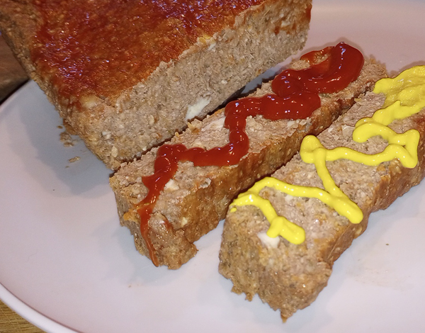vegan meatloaf and slices with ketchup and mustard