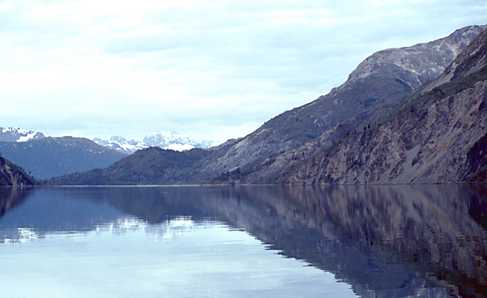 reflection of rock wall hills in alaska