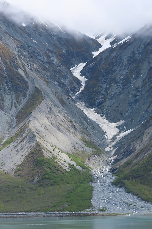 Long valley from clouds to green water in Alaska