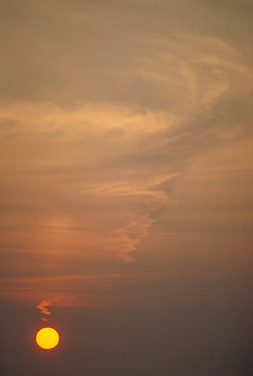 red sunset over water in alaska