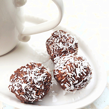 brown candy balls with coconut on outside